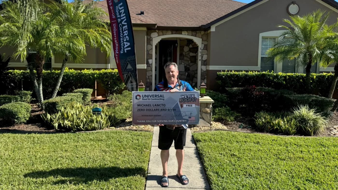 Universal Roof & Contracting presenting a free roof to veteran Michael Lancto in Florida