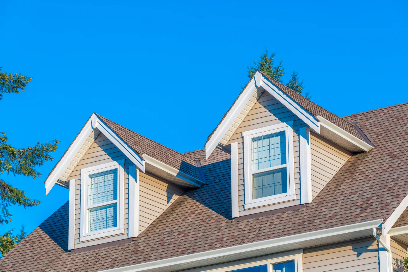 Close up of asphalt shingle roof on a two-story home