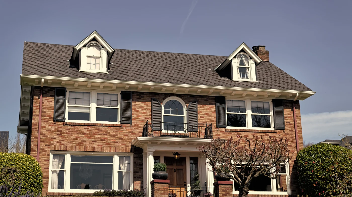 Large brick home with new asphalt shingle roof