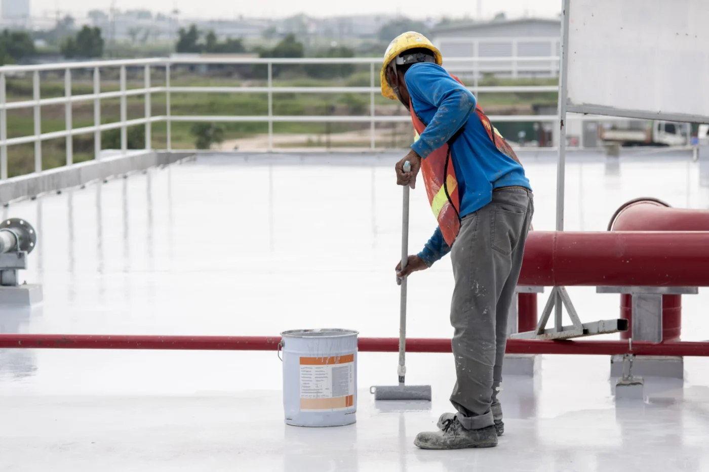 Construction Worker Coating Epoxy Paint At Roof Slab For Water P Construction Worker Coating Epoxy Paint At Roof Slab For Water P