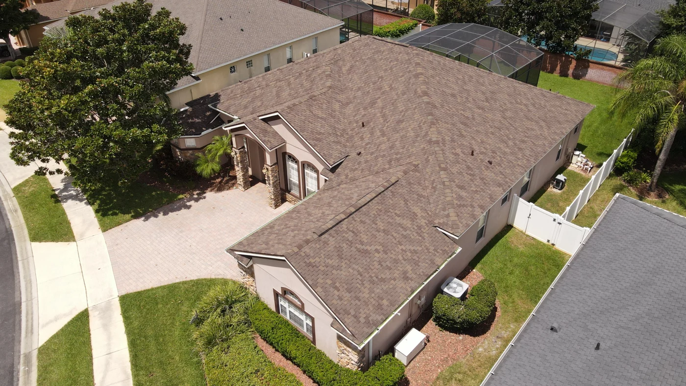Drone view of a newly installed brown shingle roof