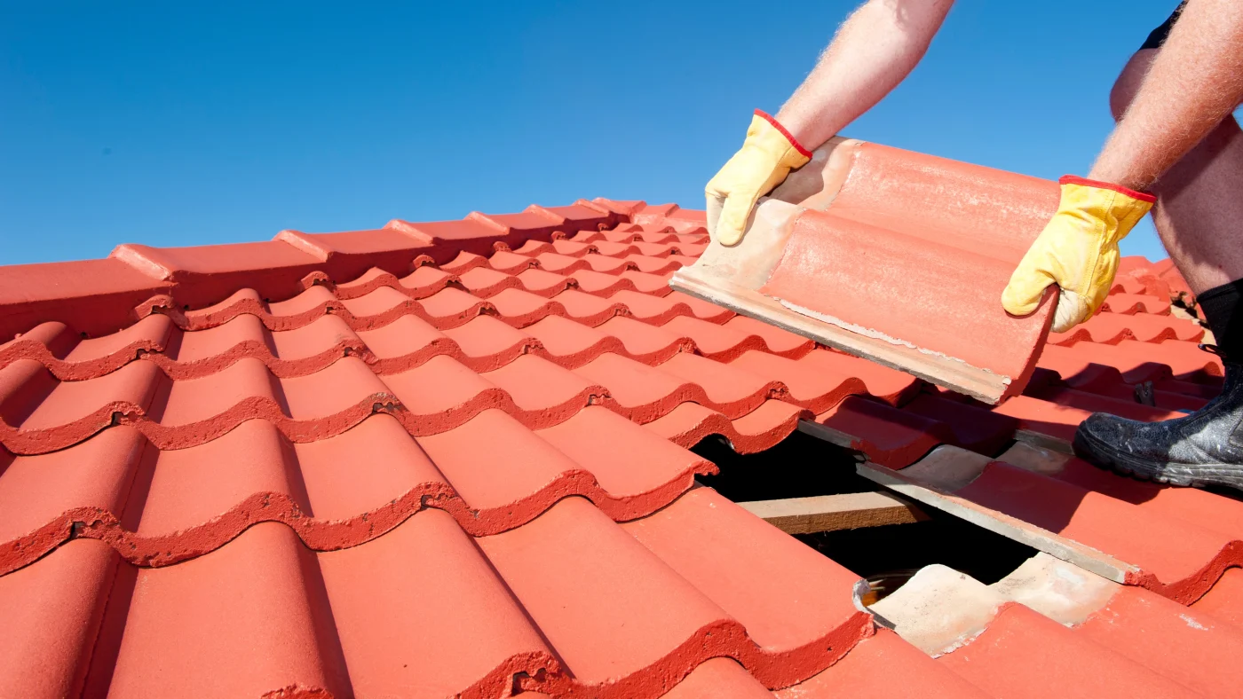Roof Repair | Central Florida | Universal Roof & Contracting A roofer repairing a tile roof in Central Florida | Universal Roof & Contracting