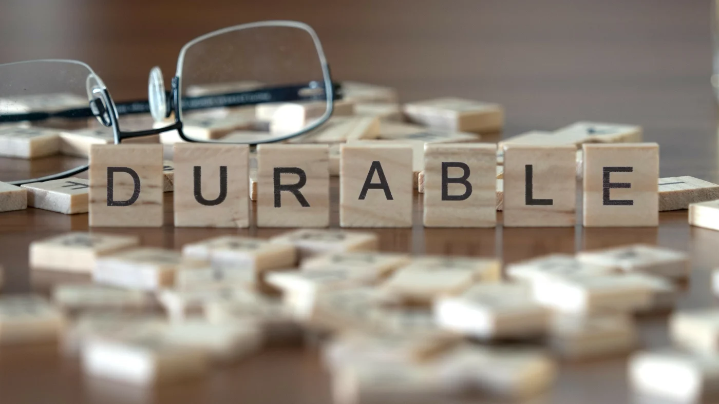 Letter tiles spell out the word DURABLE