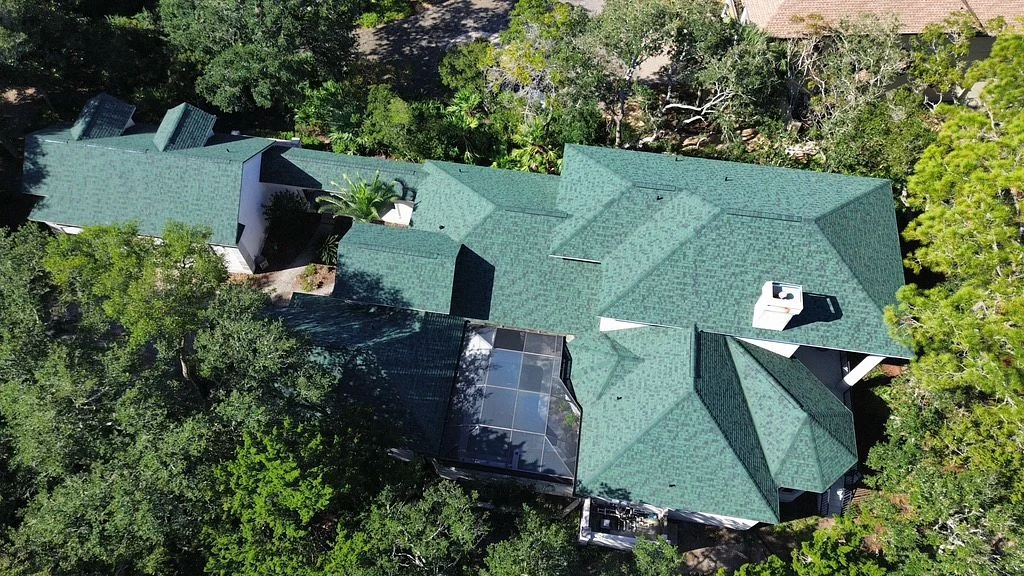 Aerial view of a large, green shingle roof