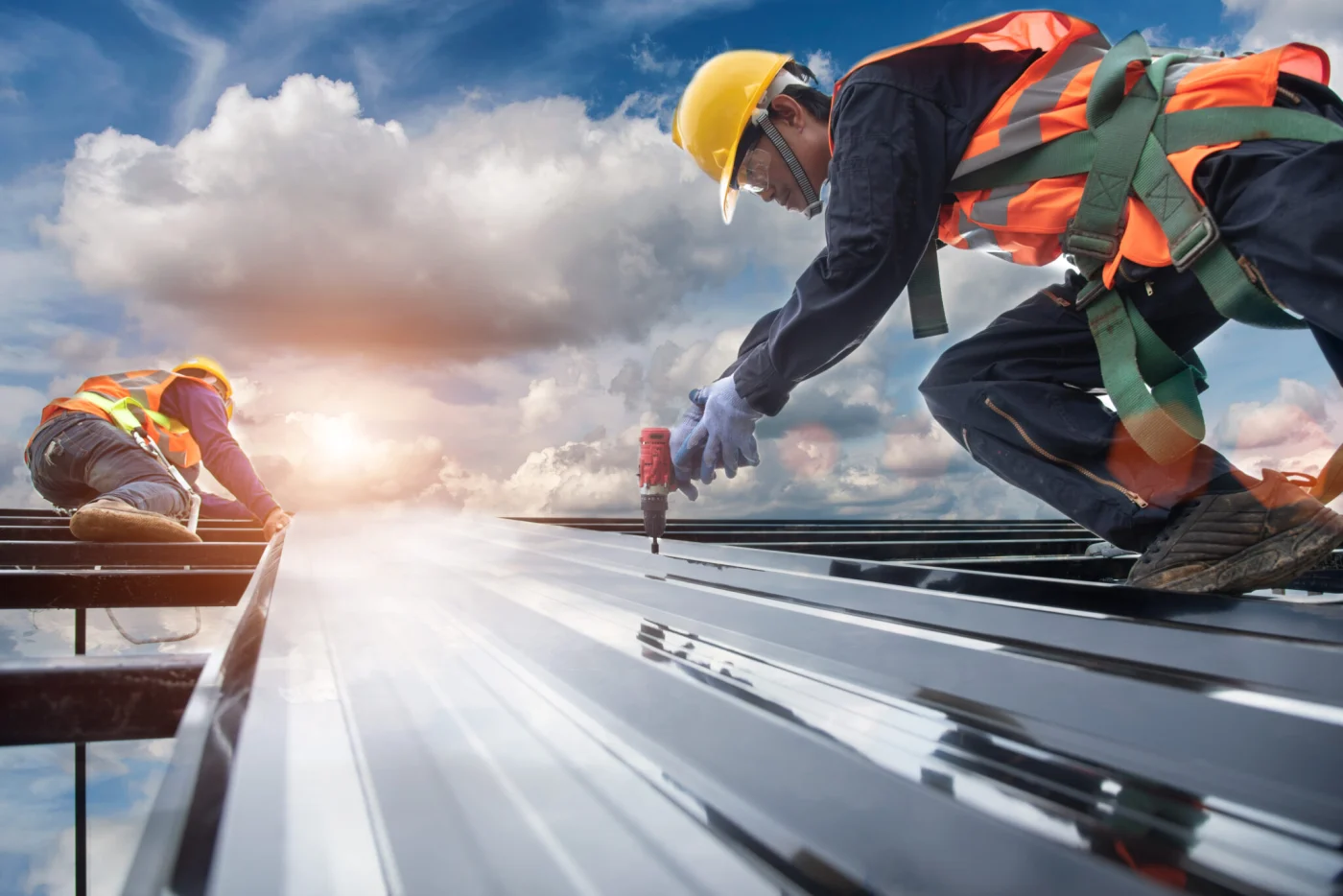 Worker Builder With Hand Drill At Metal Profile Roof Installatio Worker Builder With Hand Drill At Metal Profile Roof Installatio