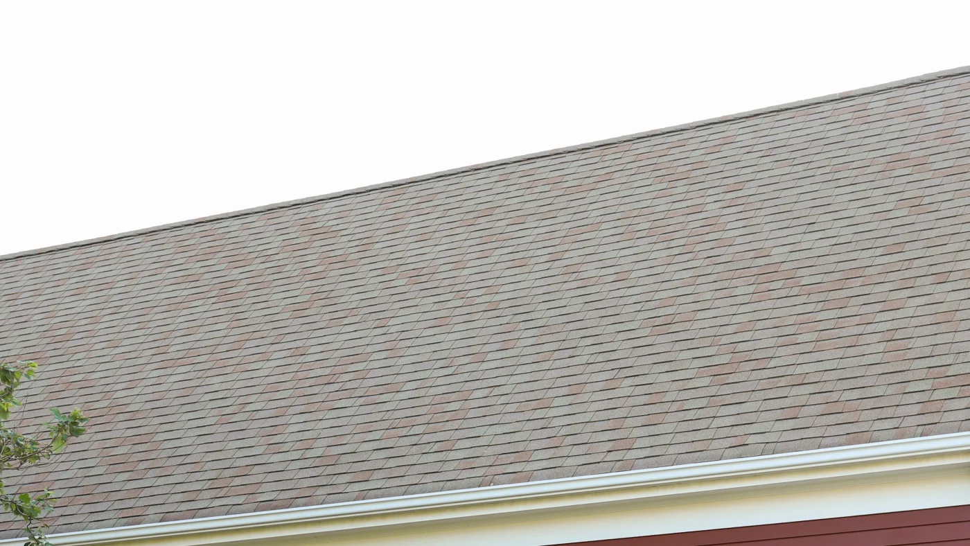 Close-up of home roof with black roofing shingles on it