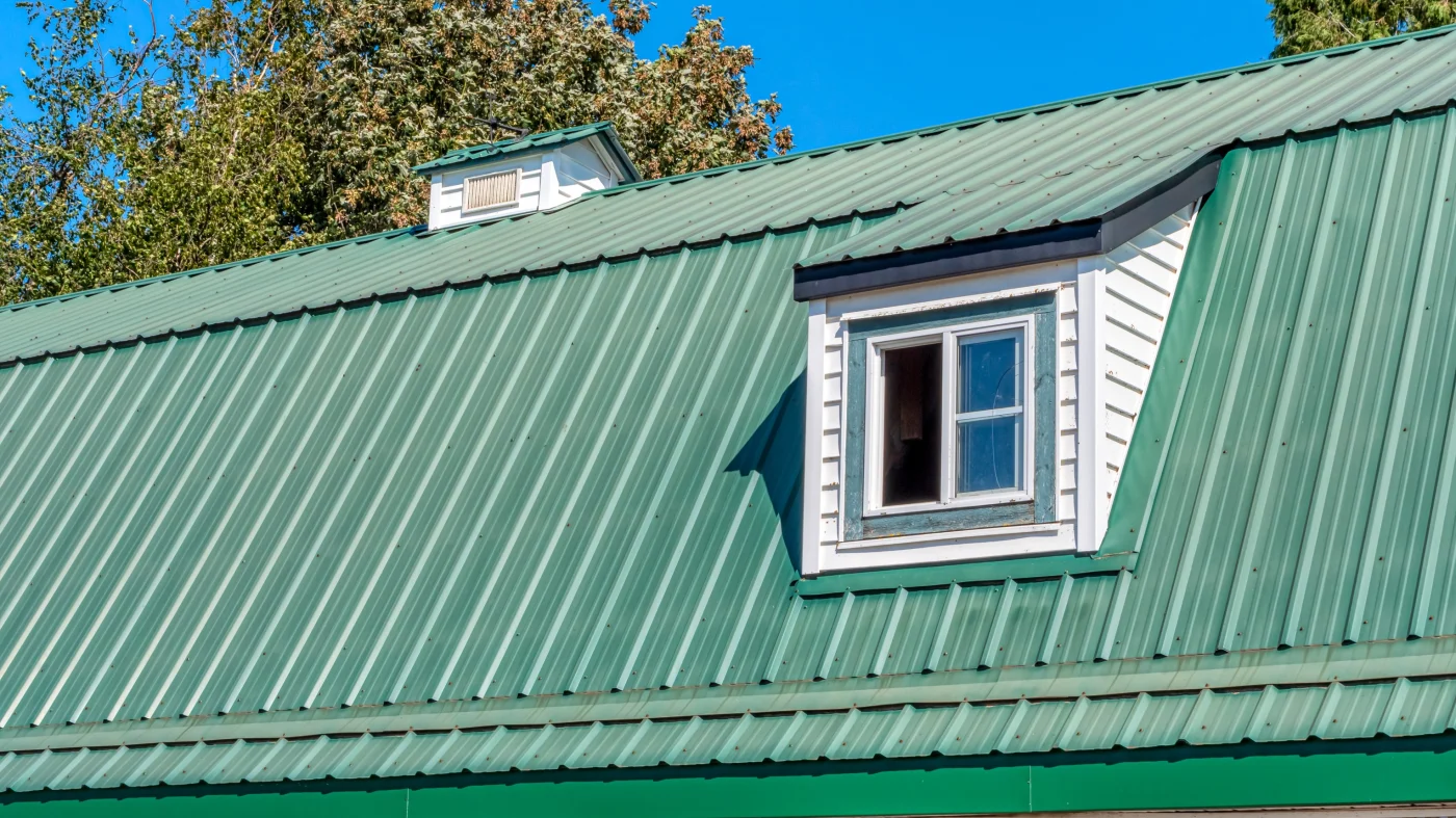 Home with olive siding and new orange tile roofing
