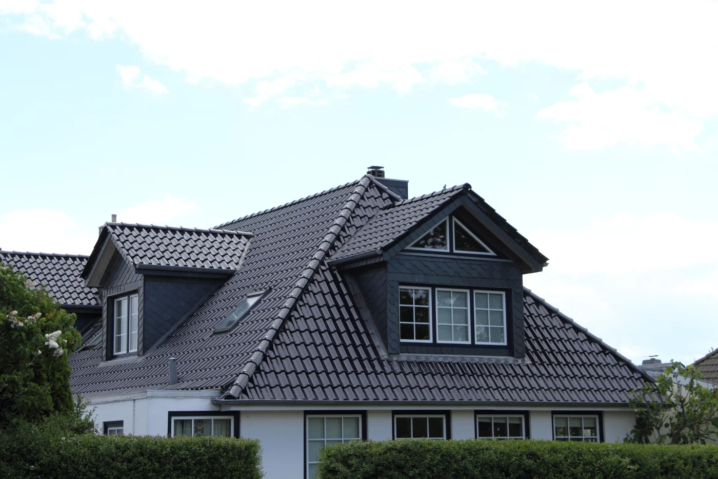 Florida residential houses with different types of roofs near the water