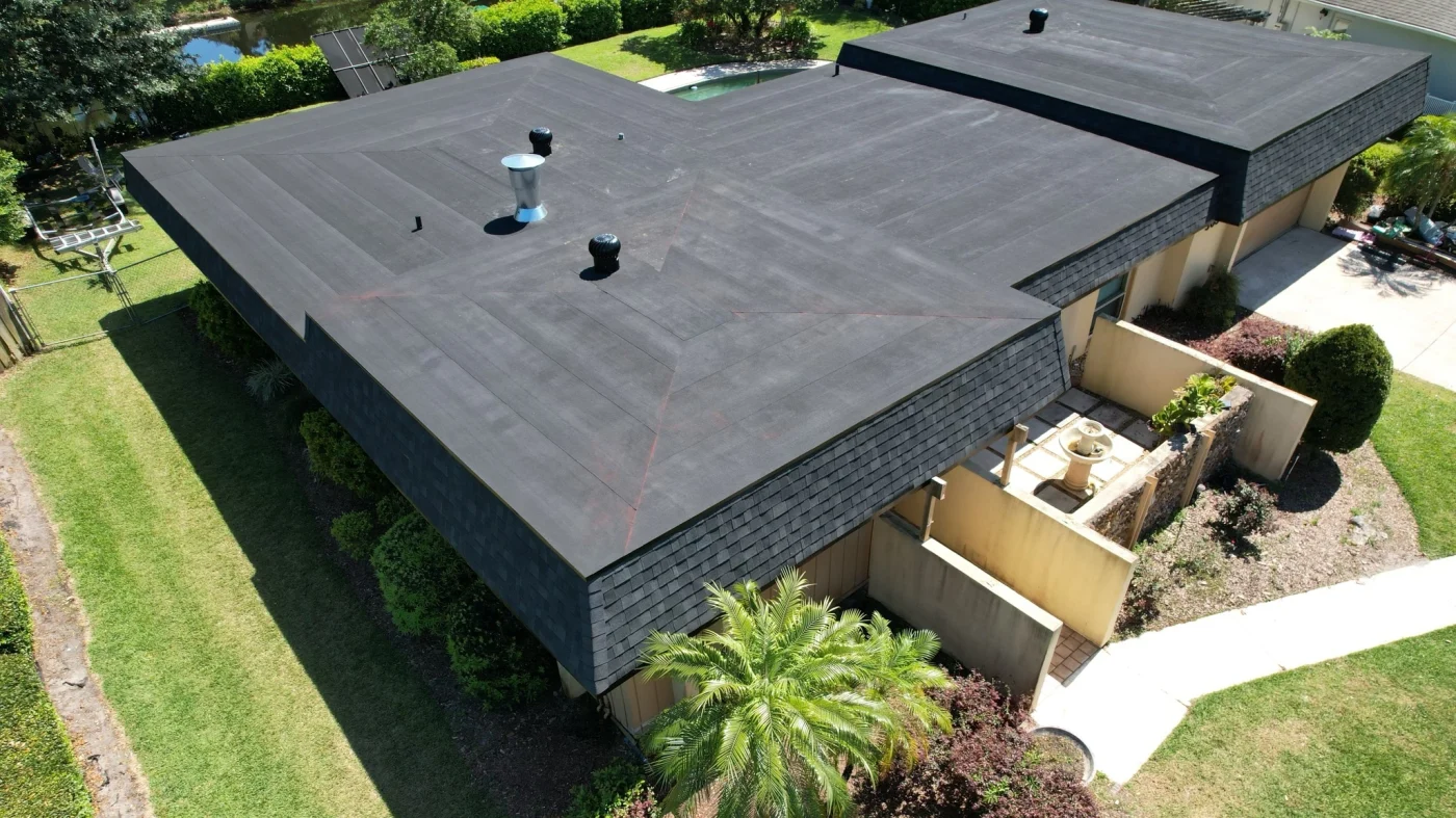 A home with a low-slope roof and large windows