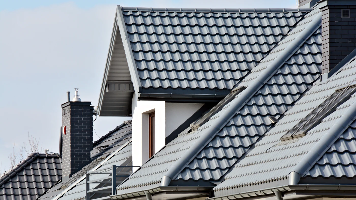 Line of homes with gray stone-coated steel roofing