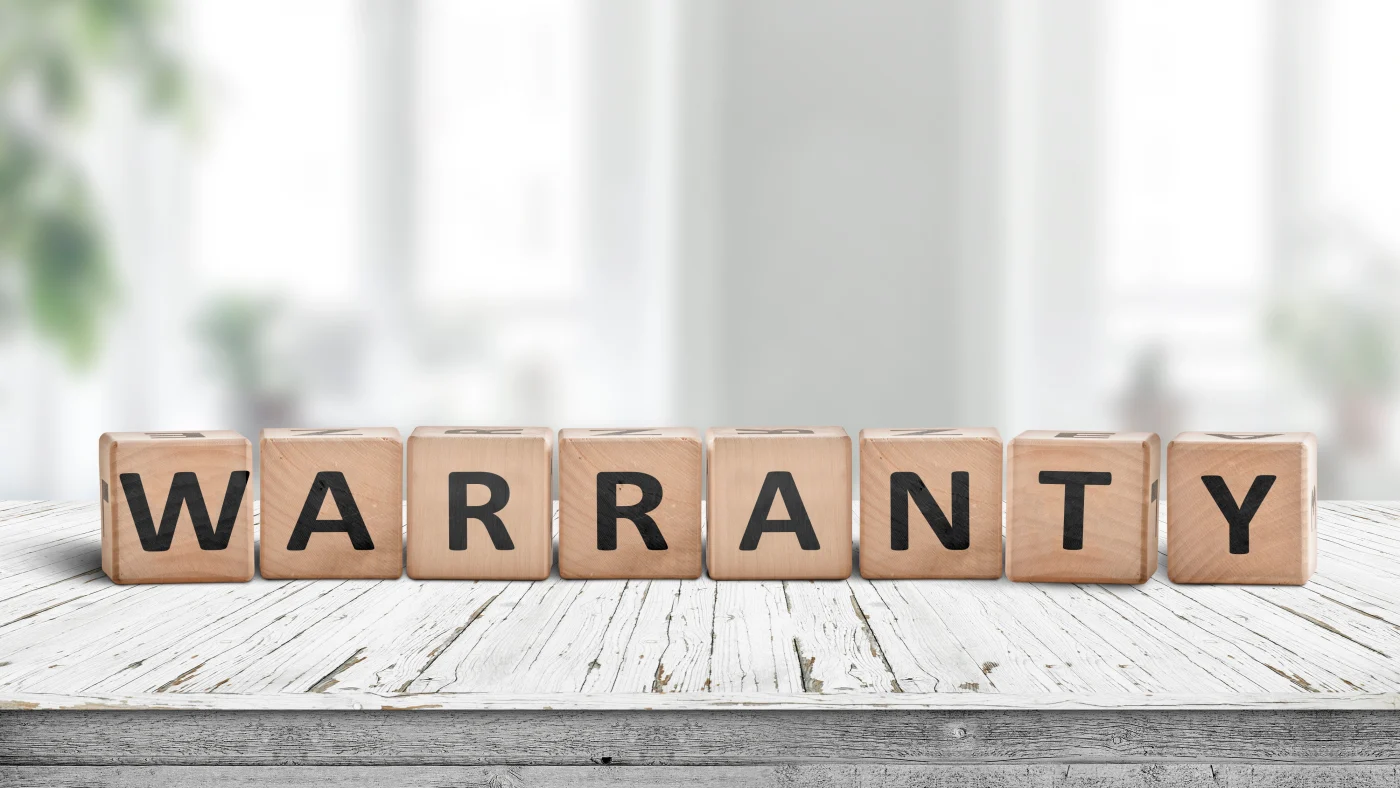 Letter blocks spelling the word “Warranty”