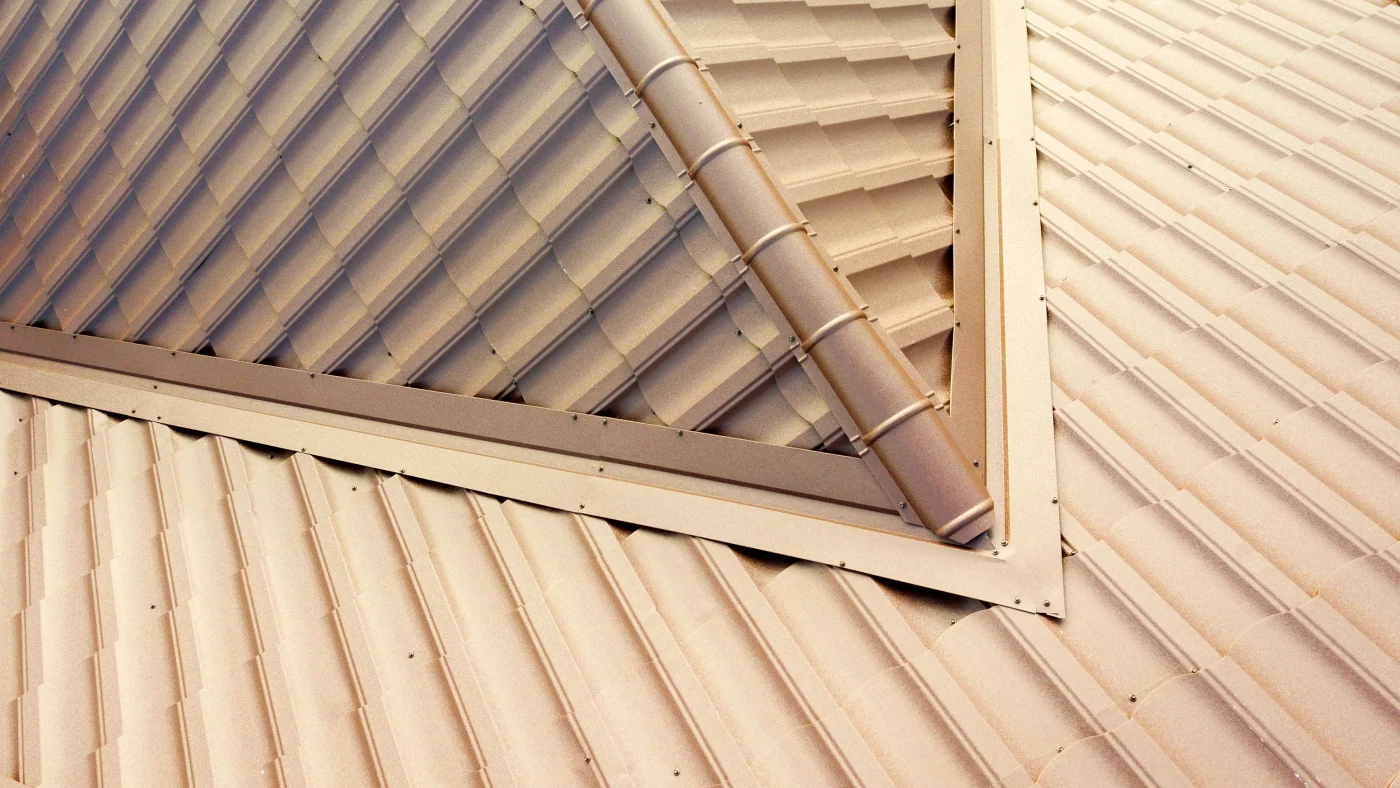 Close-up of tan metal roof ridgetop