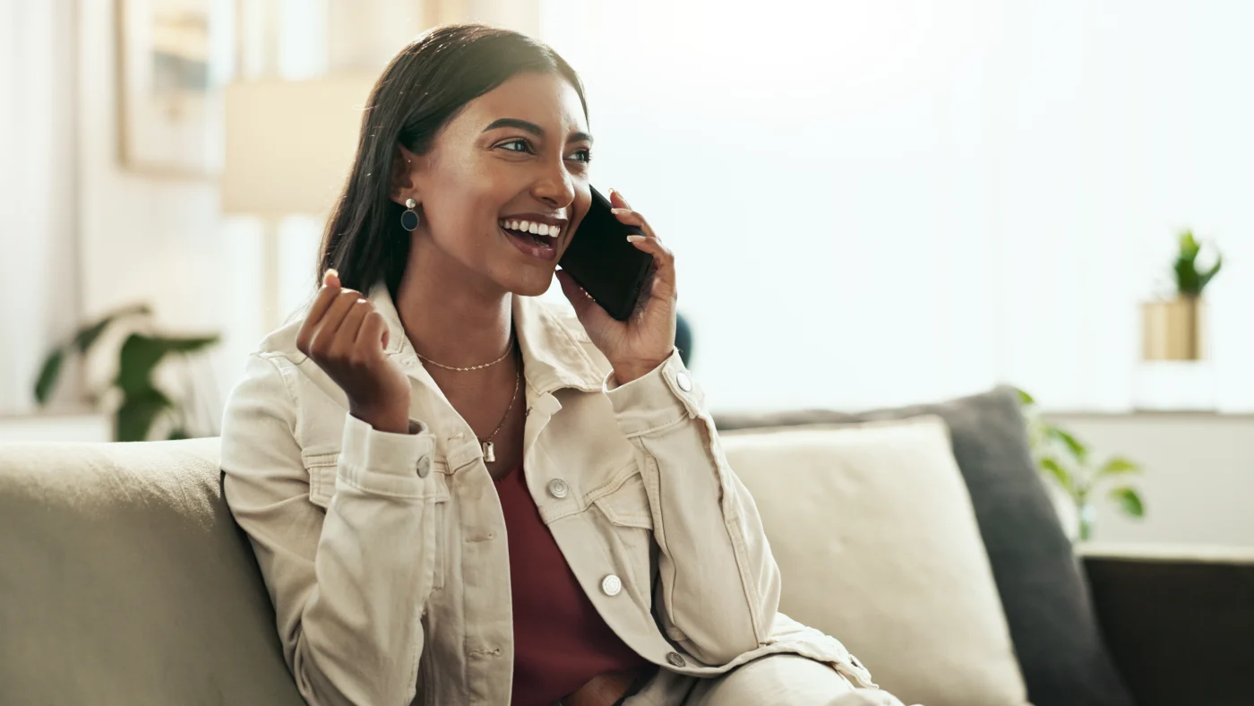 A homeowner on the phone with her insurance company
