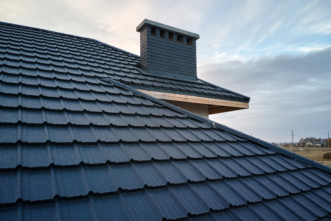 Close-up of striking metal roof tiles on a large house