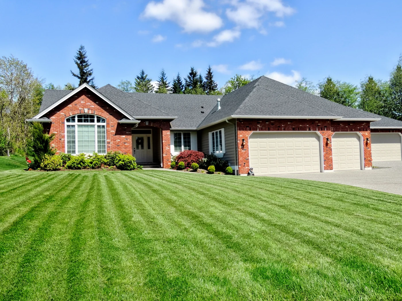Superb asphalt shingles on a charming brick house