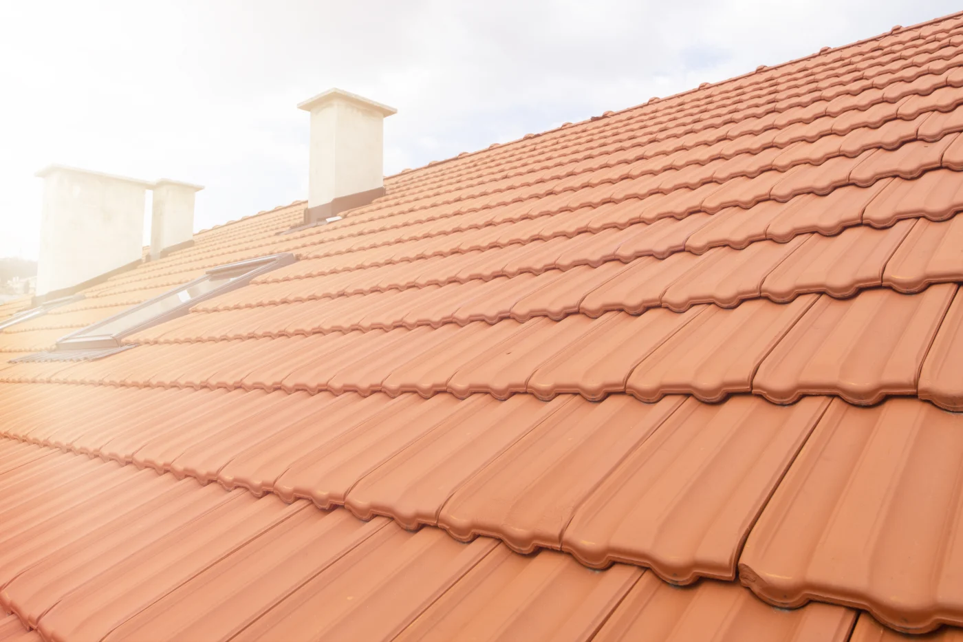 Close up of terra cotta style roofing on a home