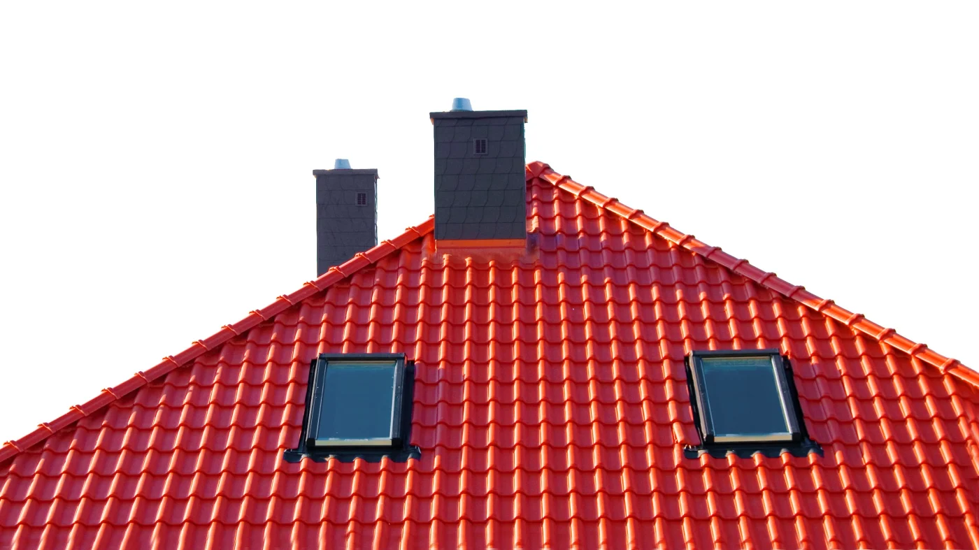 Home with steep-sloped black metal roofing