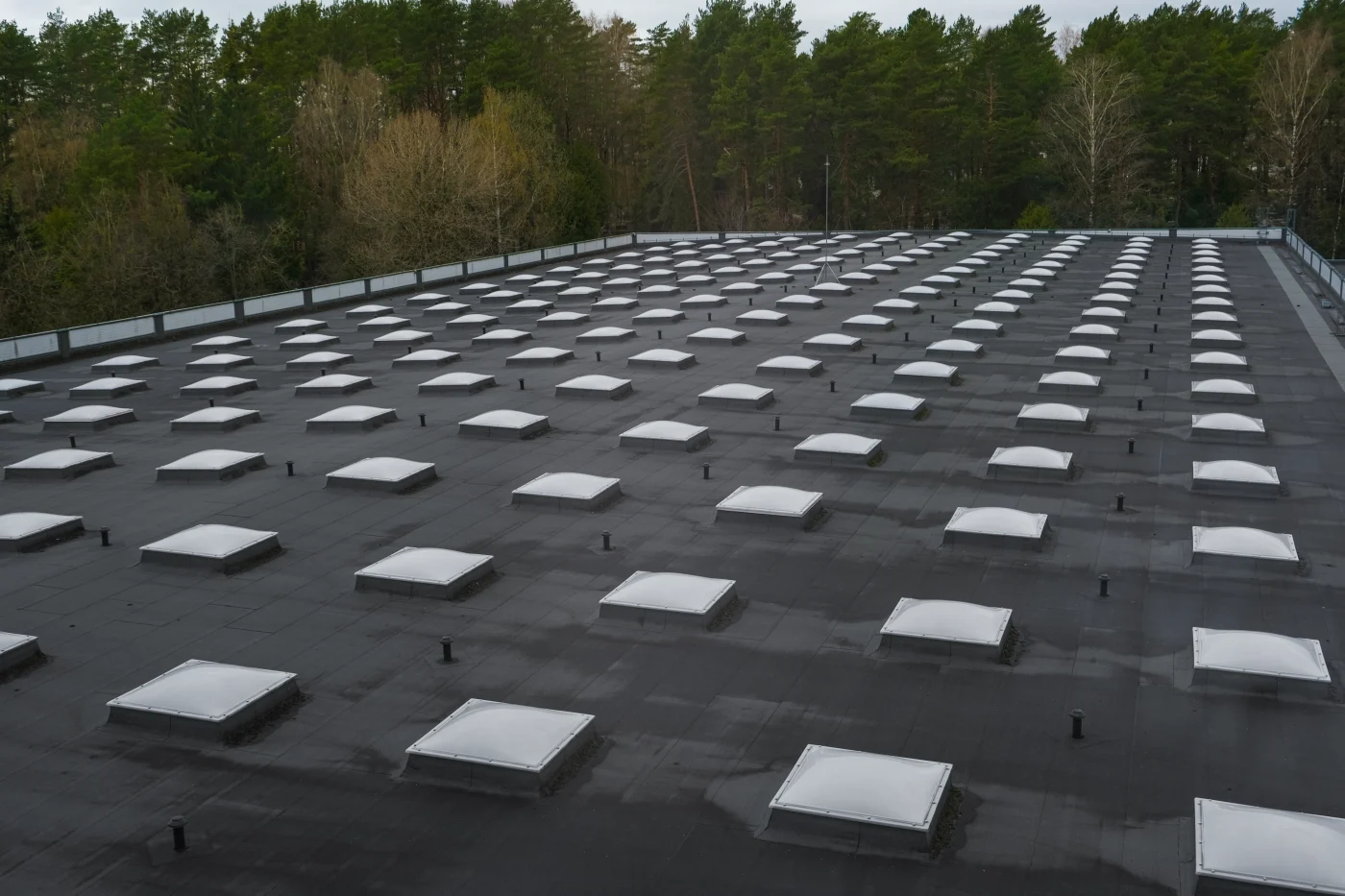 Top View Of A Modern Roof With Natural Light. Skylights. Energy Efficiency. Transparent Panels