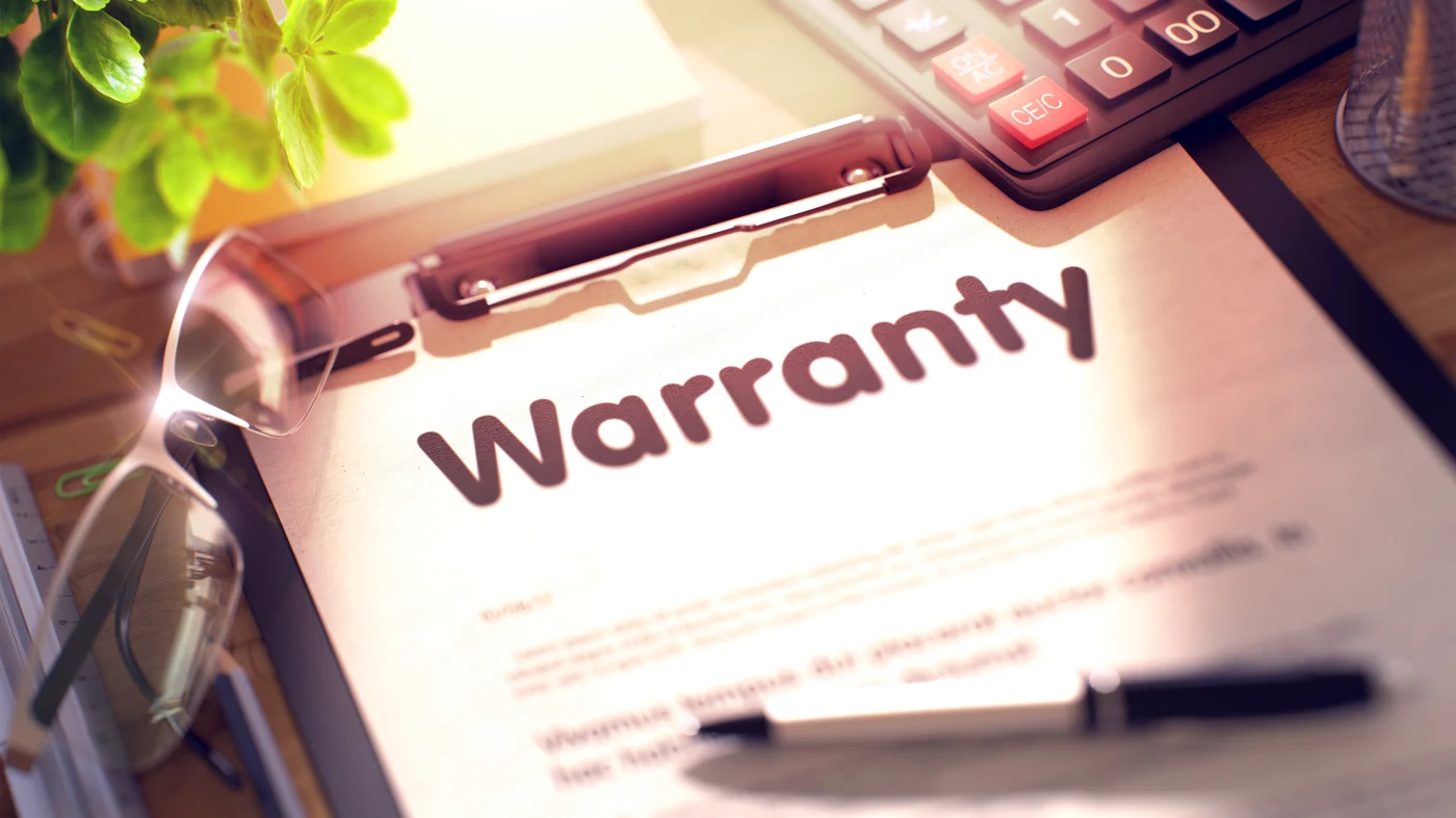 A clipboard with warranty paperwork