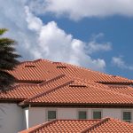 A Mediterranean-style home in Windermere, FL, features a stunning clay tile roof