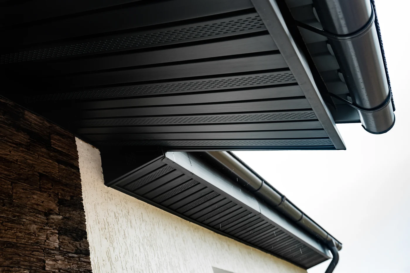 A close-up of soffit on the underside of the roof of a house.