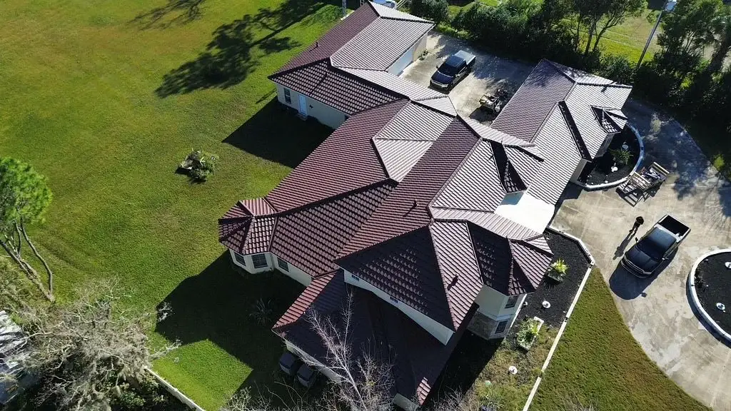 Aerial view of a single-story Florida home with a premium brown tile roof.