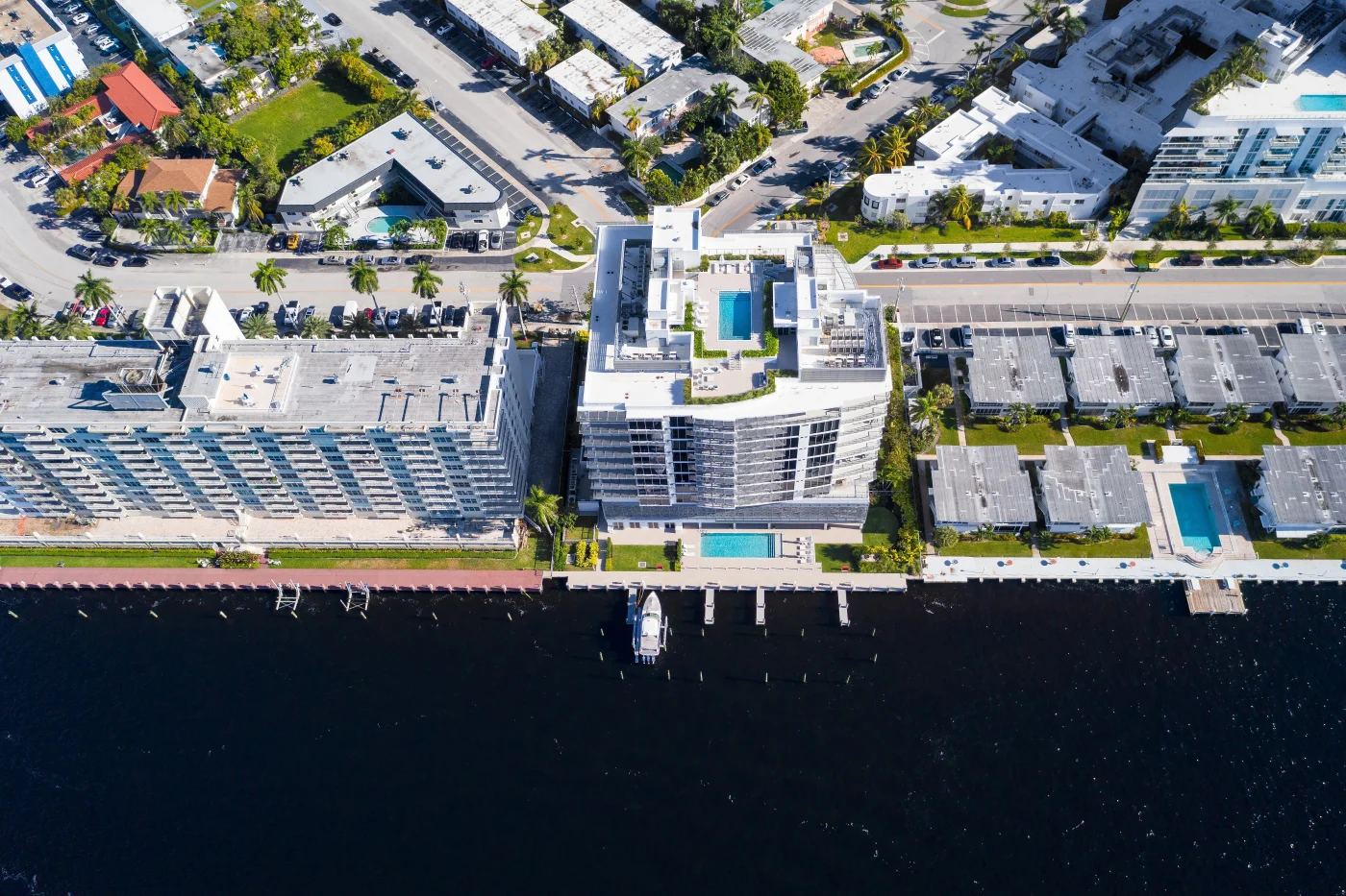 Exquisite Commercial Roofing | Riverview, FL | Universal Roof and Contracting Aerial view of waterfront condominiums and apartment buildings with flat commercial roofs.